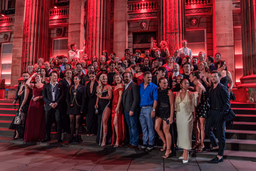 Cast of Moulin Rouge! The Musical gathered on the red-lit steps of The Dome, Edinburgh