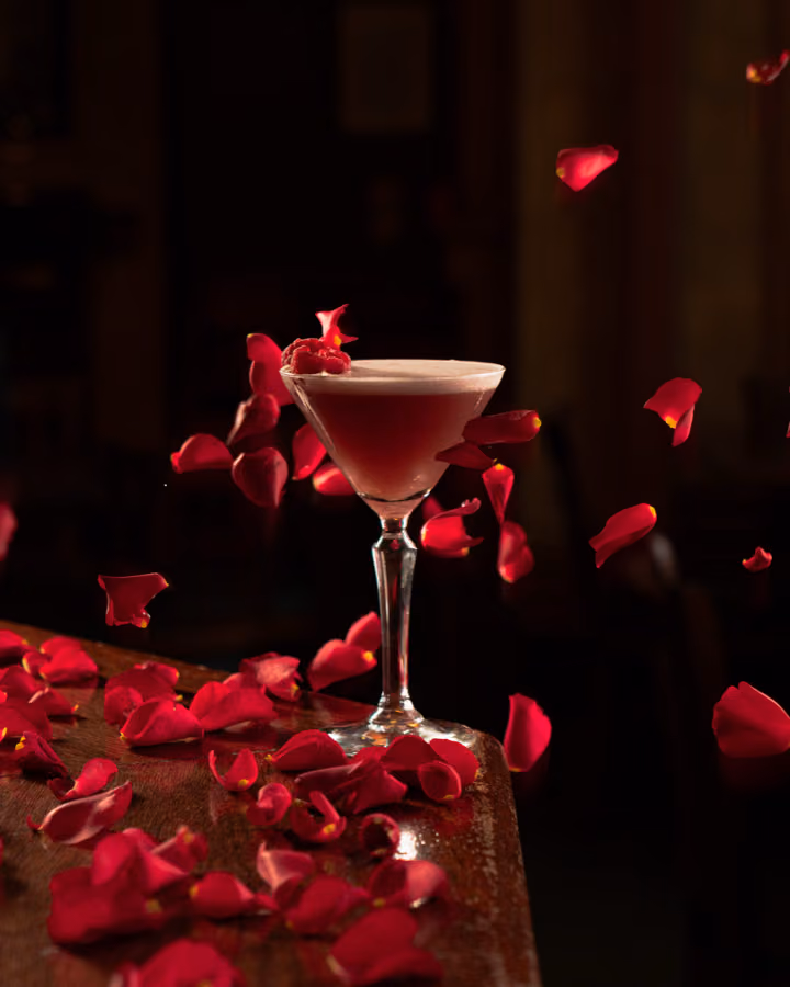 Cocktail with falling rose petals at Tiles Bar, Edinburgh