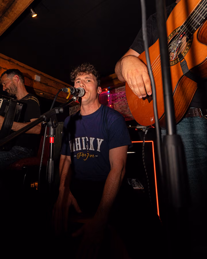 Live folk band performing at West Nic Records, Edinburgh